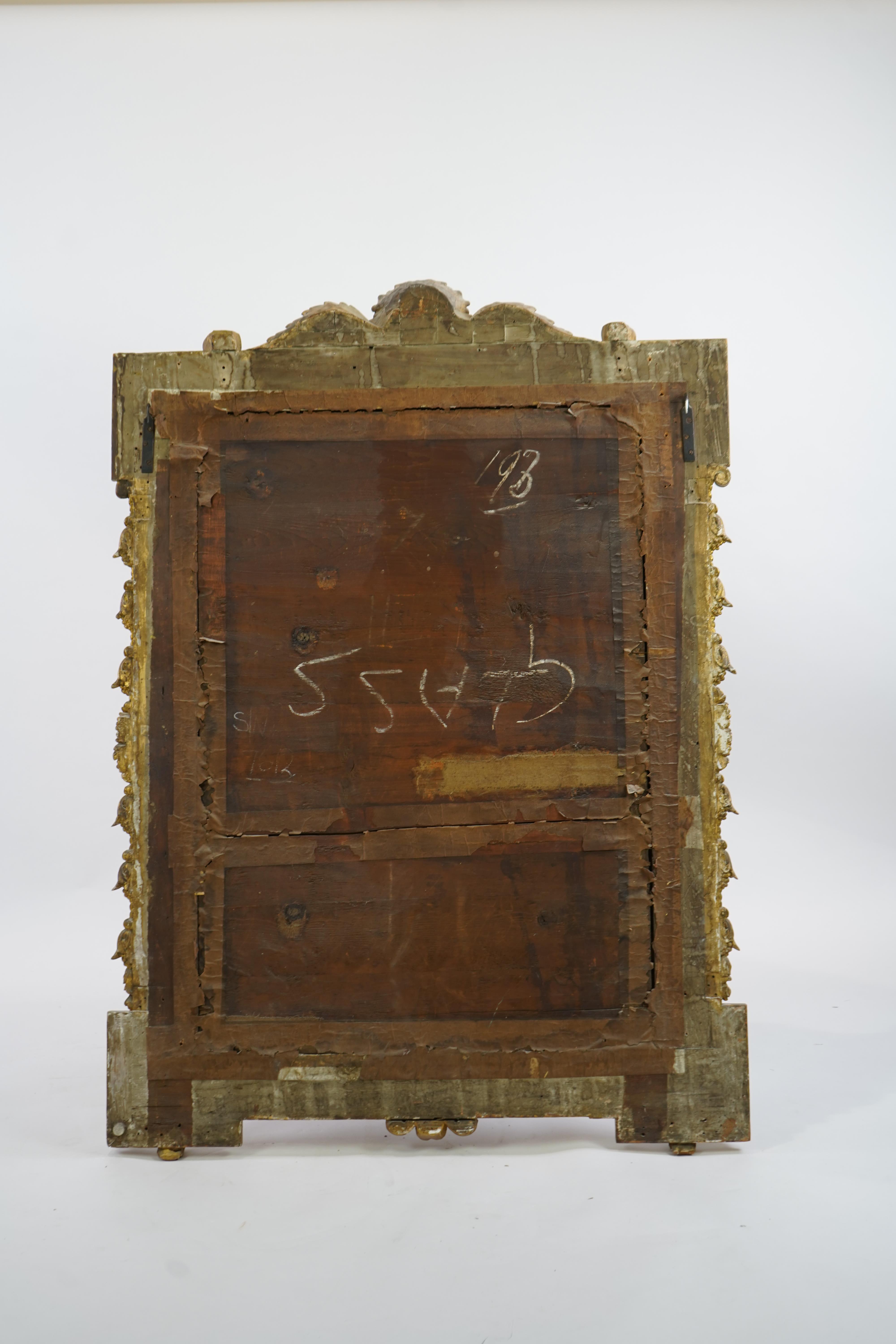 A late 19th century French carved gilt wood and composition overmantel mirror